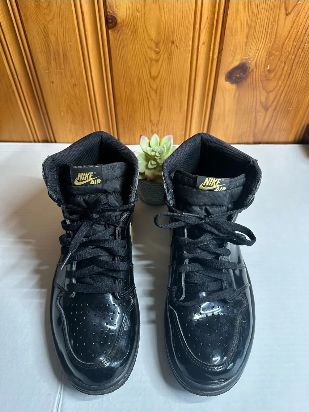 Nike Air High-Top Sneakers in Black with Gold Logo